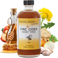 Mickelberry Gardens Fire Cider bottle on wood highlights bold flavor for meals.