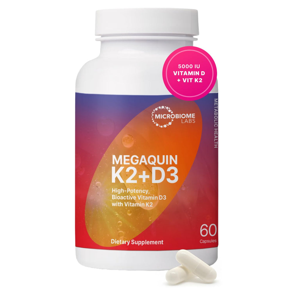 Microbiome Labs MegaQuin D3 + K2 bottle on a kitchen counter for daily wellness.