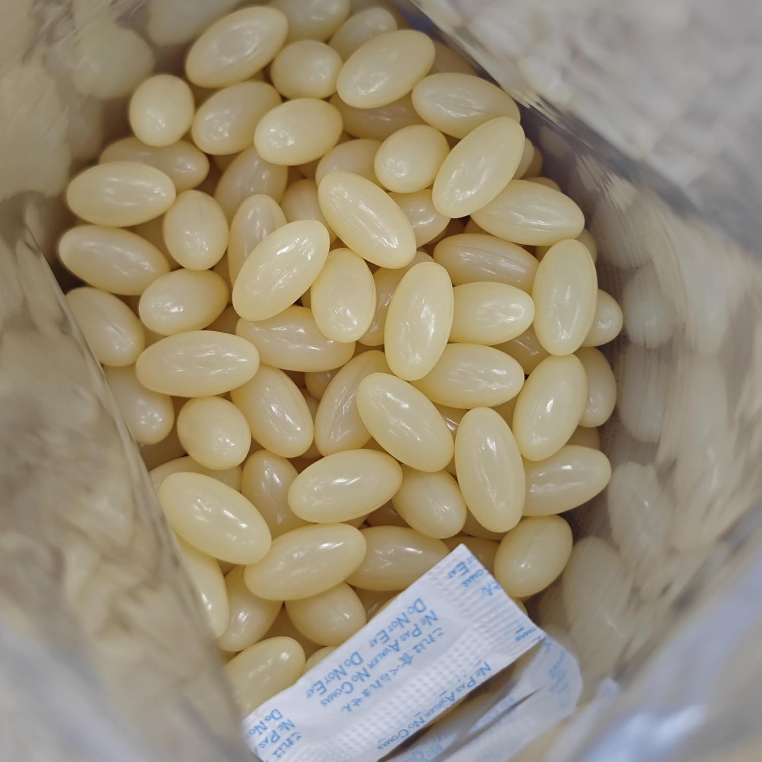 In hand MicroLabs D3 K2 bottle illustrating portable vitamin supplement
