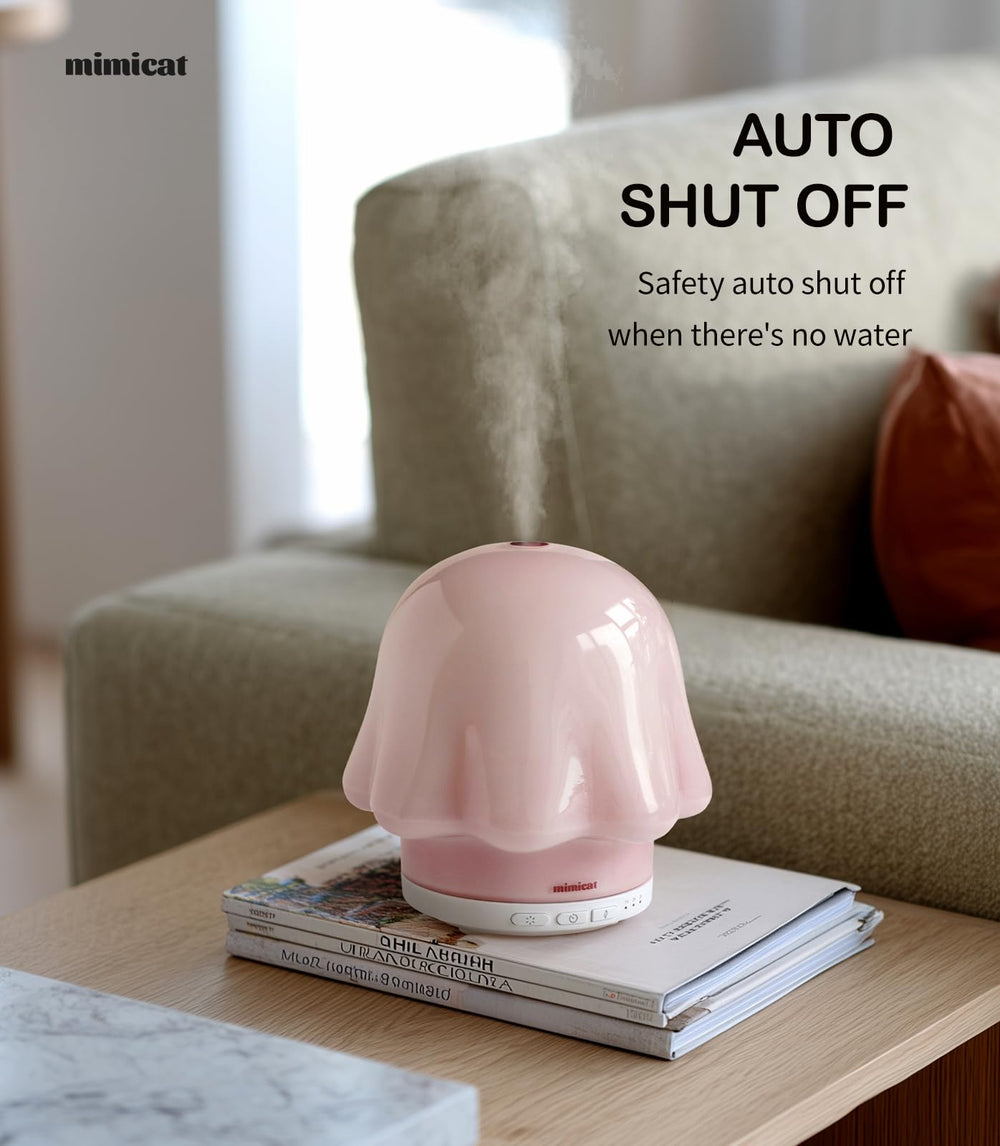 mimicat handmade glass diffuser showing a soft pink glow in cozy spaces