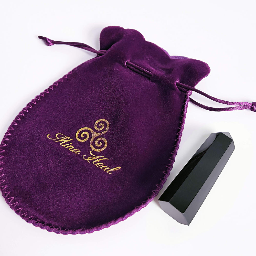 Mina Heal Black Obsidian wand with aura-purifying potential during meditation practice