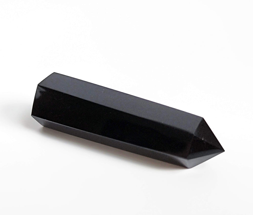 Mina Heal Black Obsidian wand close-up highlighting six facets for tactile meditation cues