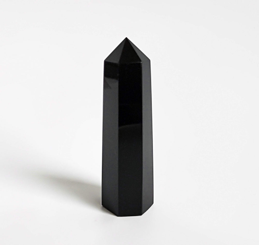 Mina Heal Black Obsidian wand displayed on desk as a mindful decor piece