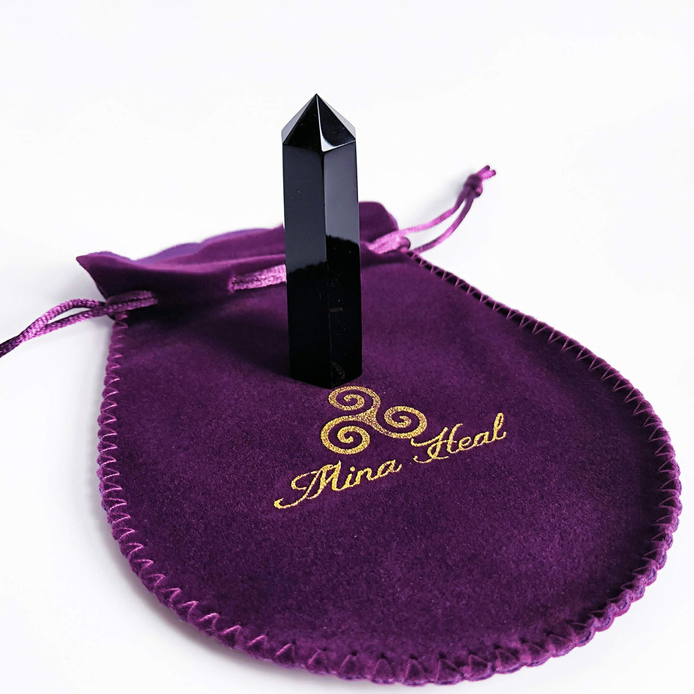 Mina Heal Black Obsidian wand in hand ideal for personal energy sessions and chakra focus