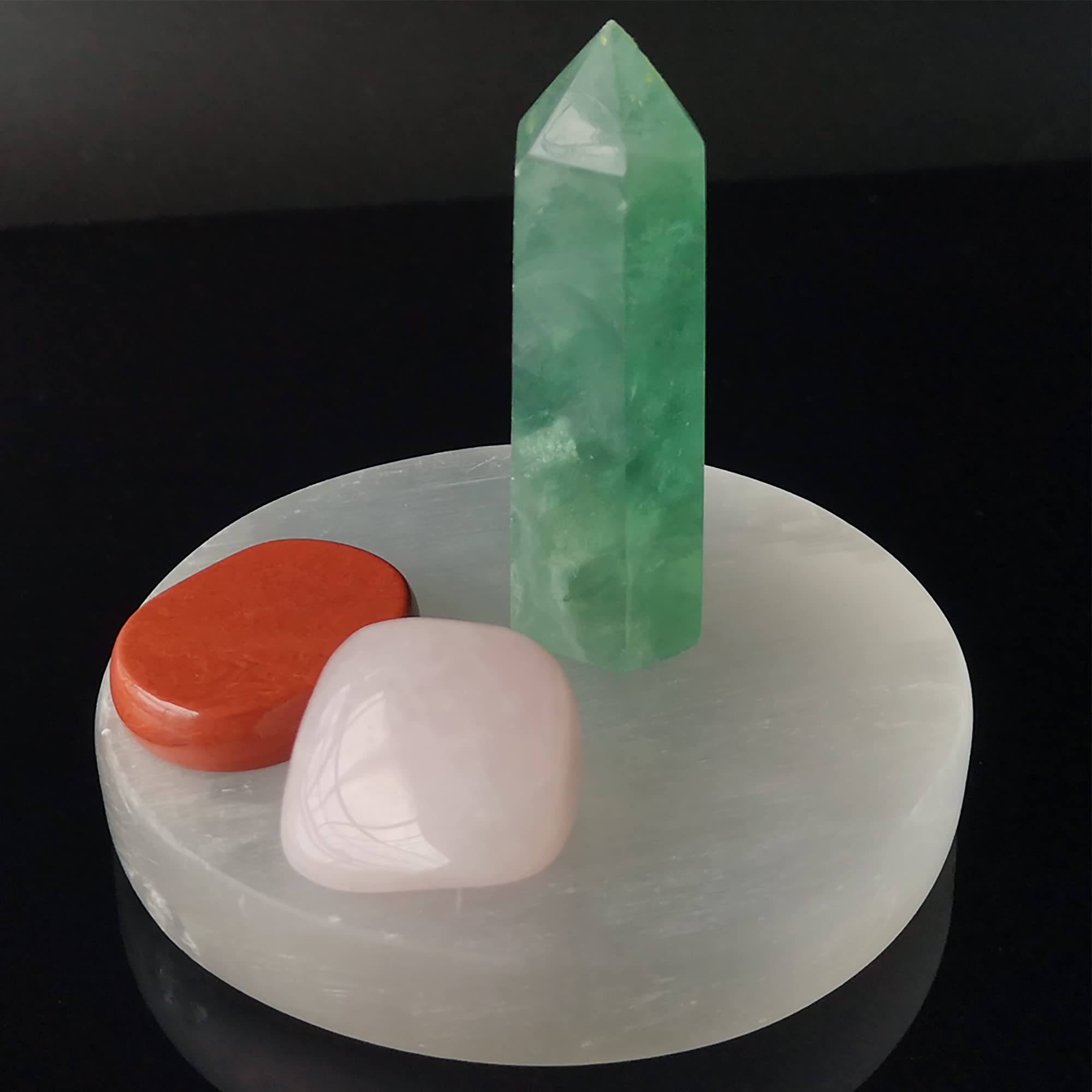 Mina Heal selenite disc used for energy protection during mindful practice