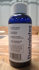 Mineralife electrolyte drops entering water for quick hydration.