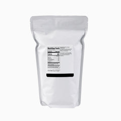Minimalist Rice Protein being poured into a shaker for easy smoothies