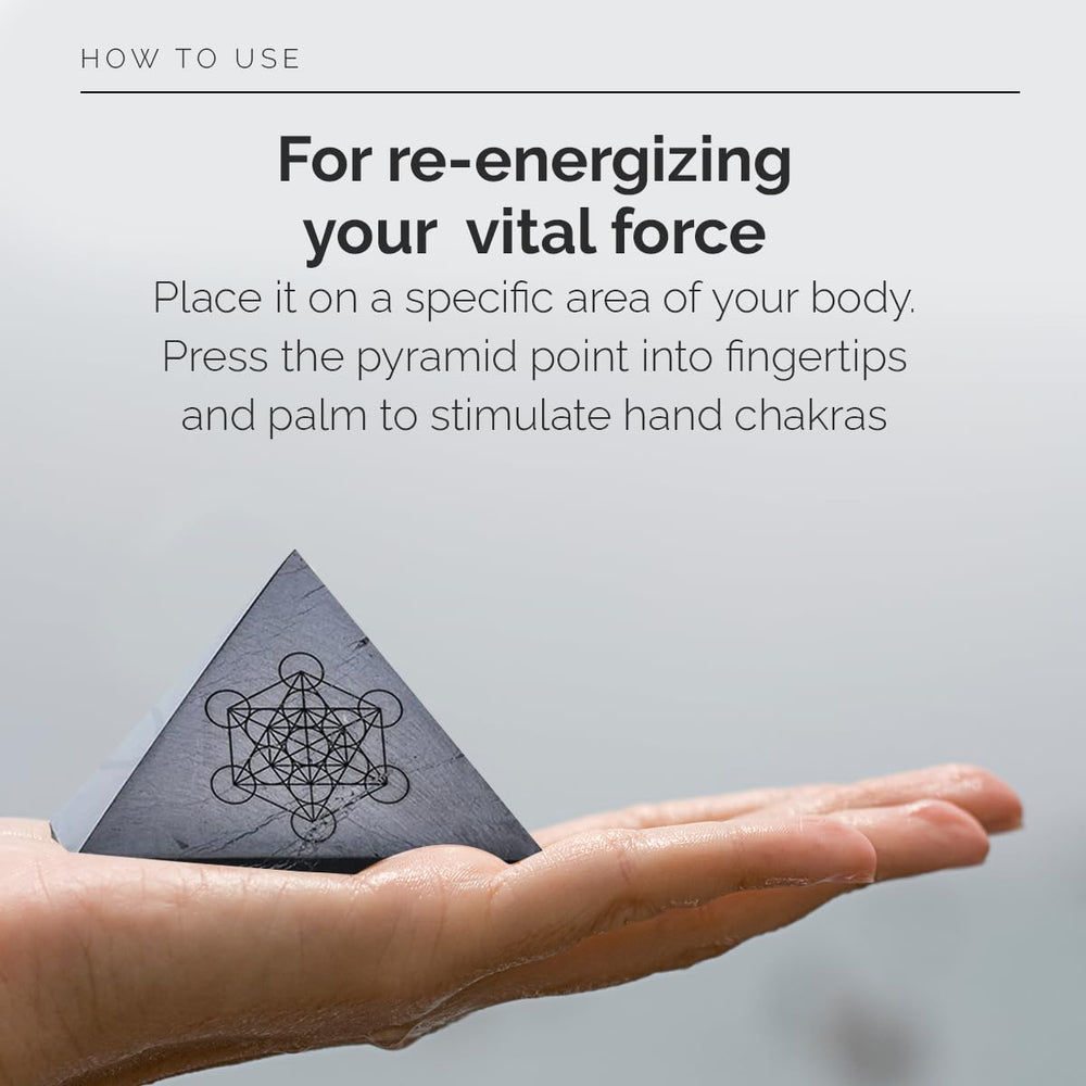 Modern ŌM Clear Quartz pyramid top view showing master healer symbol