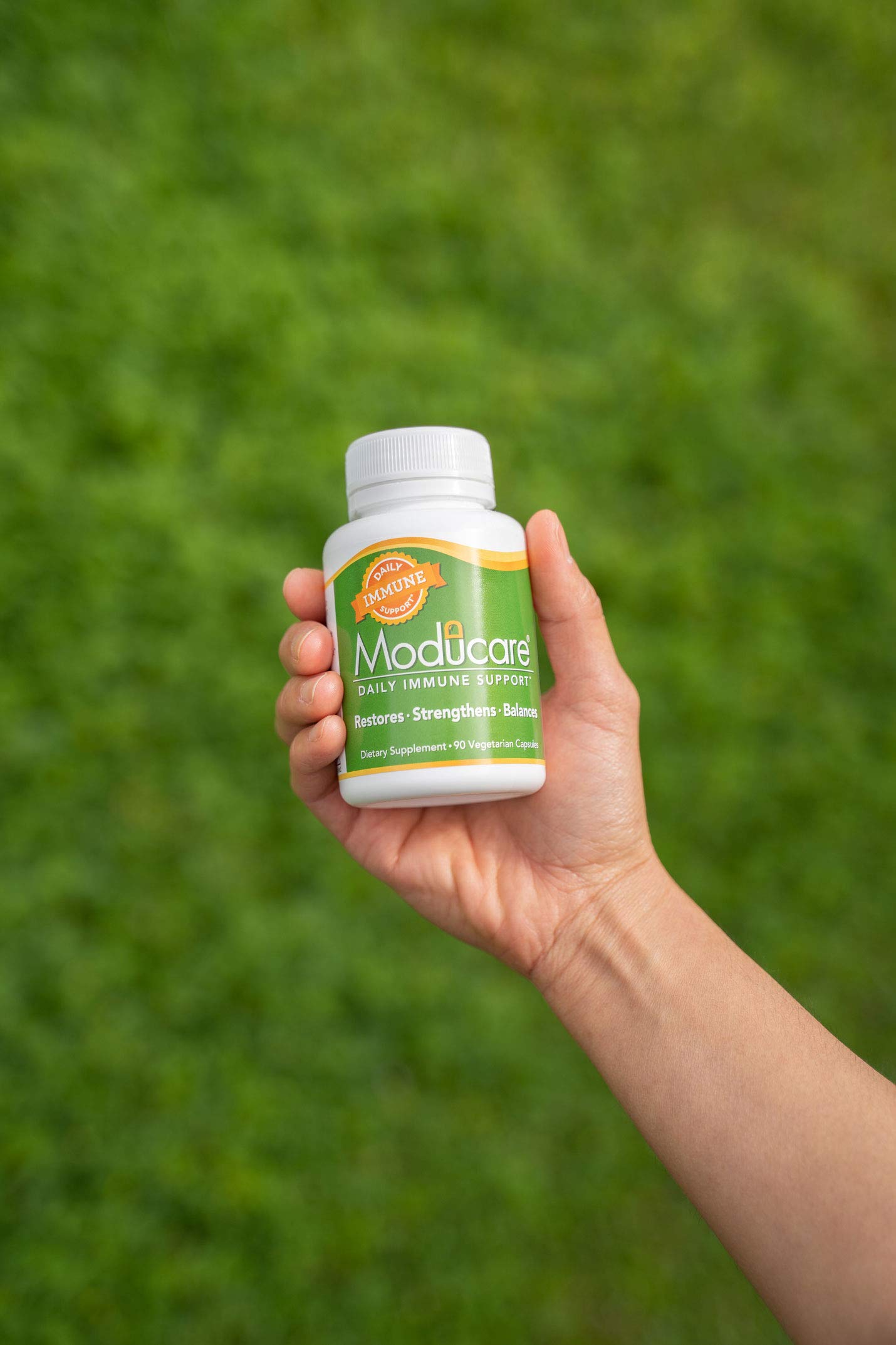 Moducare capsules shown on desk suggesting everyday routine use.
