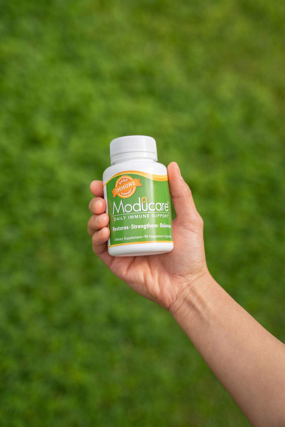 Moducare capsules shown on desk suggesting everyday routine use.