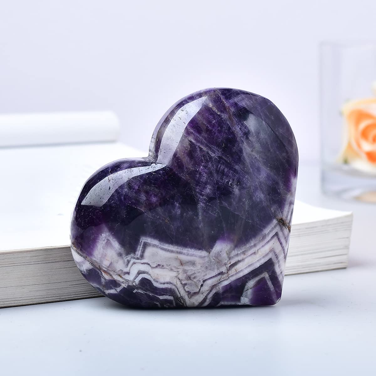MOGEMT Dream Amethyst heart palm stone in hand; portable calm companion.