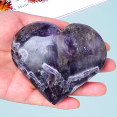 MOGEMT Dream Amethyst heart palm stone side view; natural color variation for soothing ambience.
