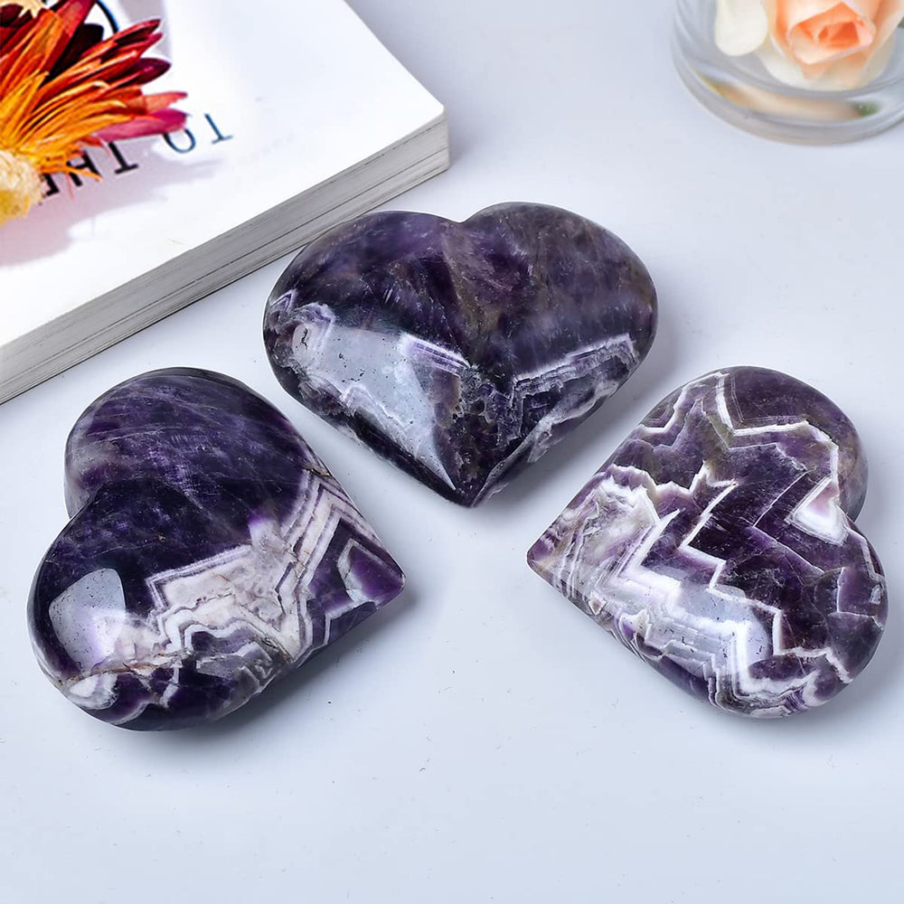 MOGEMT Dream Amethyst heart palm stone top-down; symmetrical focal point for meditation.