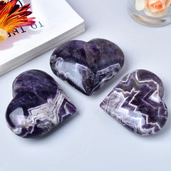MOGEMT Dream Amethyst heart palm stone top-down; symmetrical focal point for meditation.