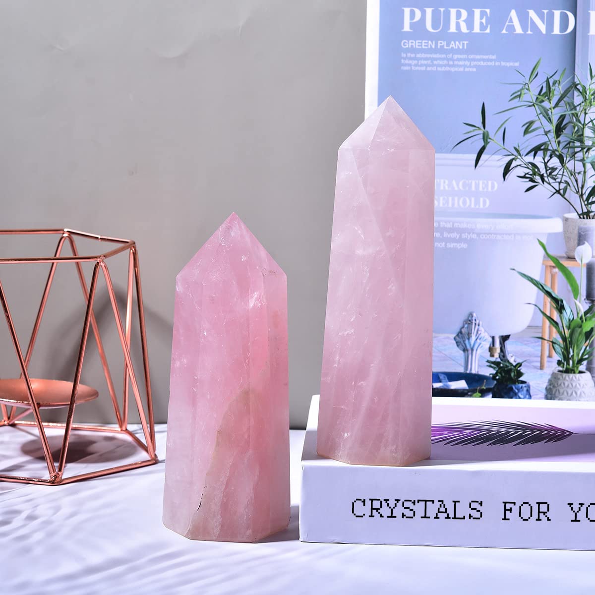 MOGEMT rose quartz obelisk with natural color variations and texture.