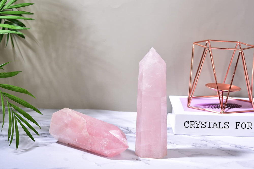 MOGEMT soft pink glow from rose quartz obelisk at dusk.