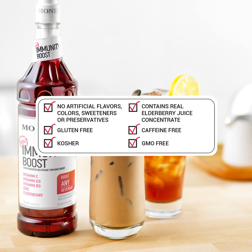 Monin Total Immunity Boost bottle beside coffee for immune support