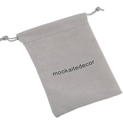 Mookaitedecor Star Coin palm stone for grounding and material focus in grids.