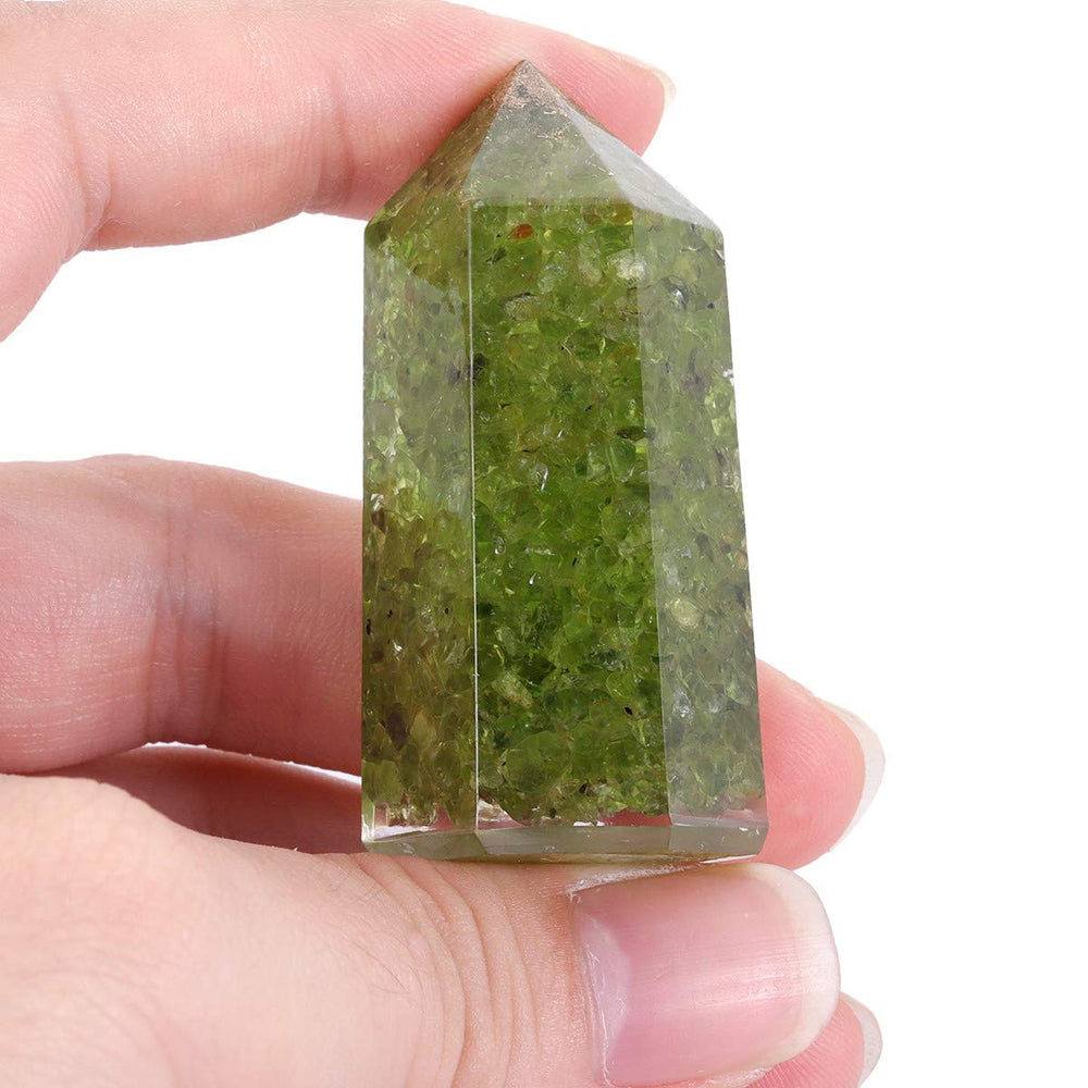 Mookaitedecor peridot wand close-up with polished facets for focused energy work.