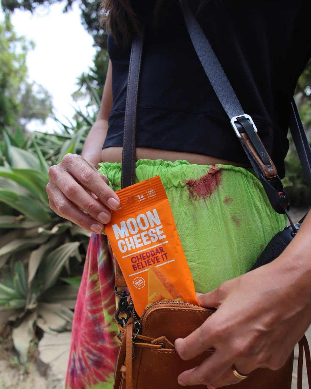 Moon Cheese Cheddar Believe It on a hiking trail snack.
