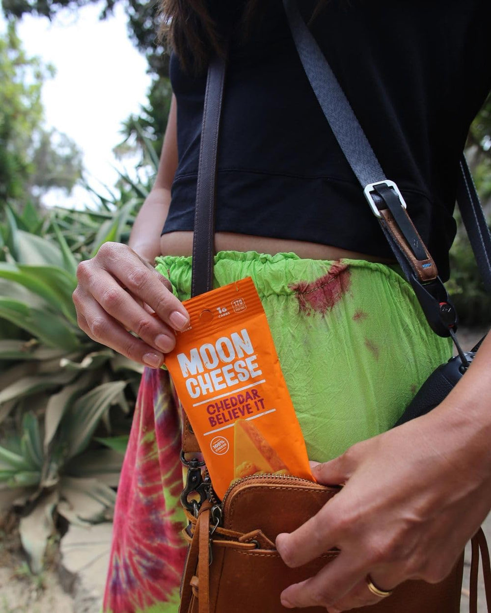 Moon Cheese Cheddar Believe It on a hiking trail snack.