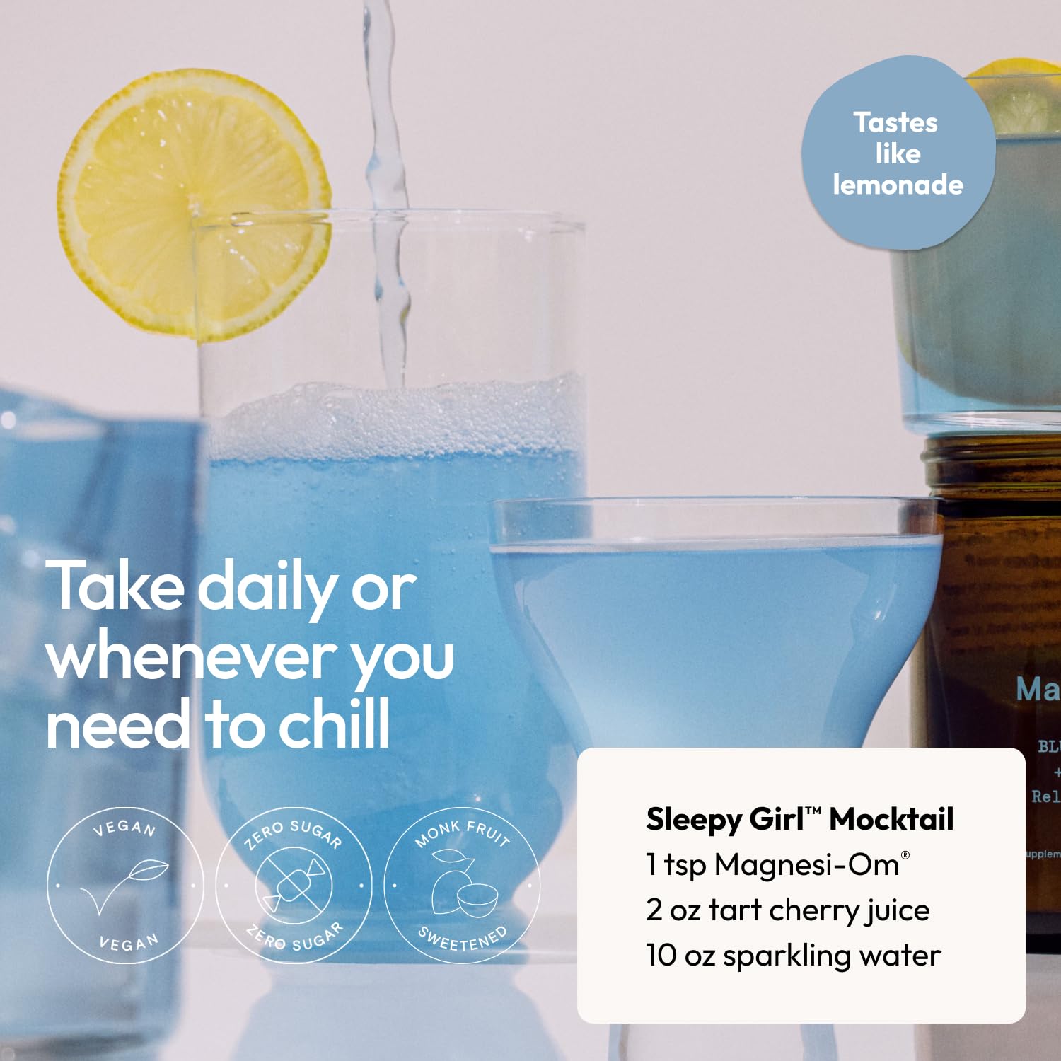 Moon Juice Magnesi-om Blue Lemon Jar beside glass mixer, ready for a refreshing drink