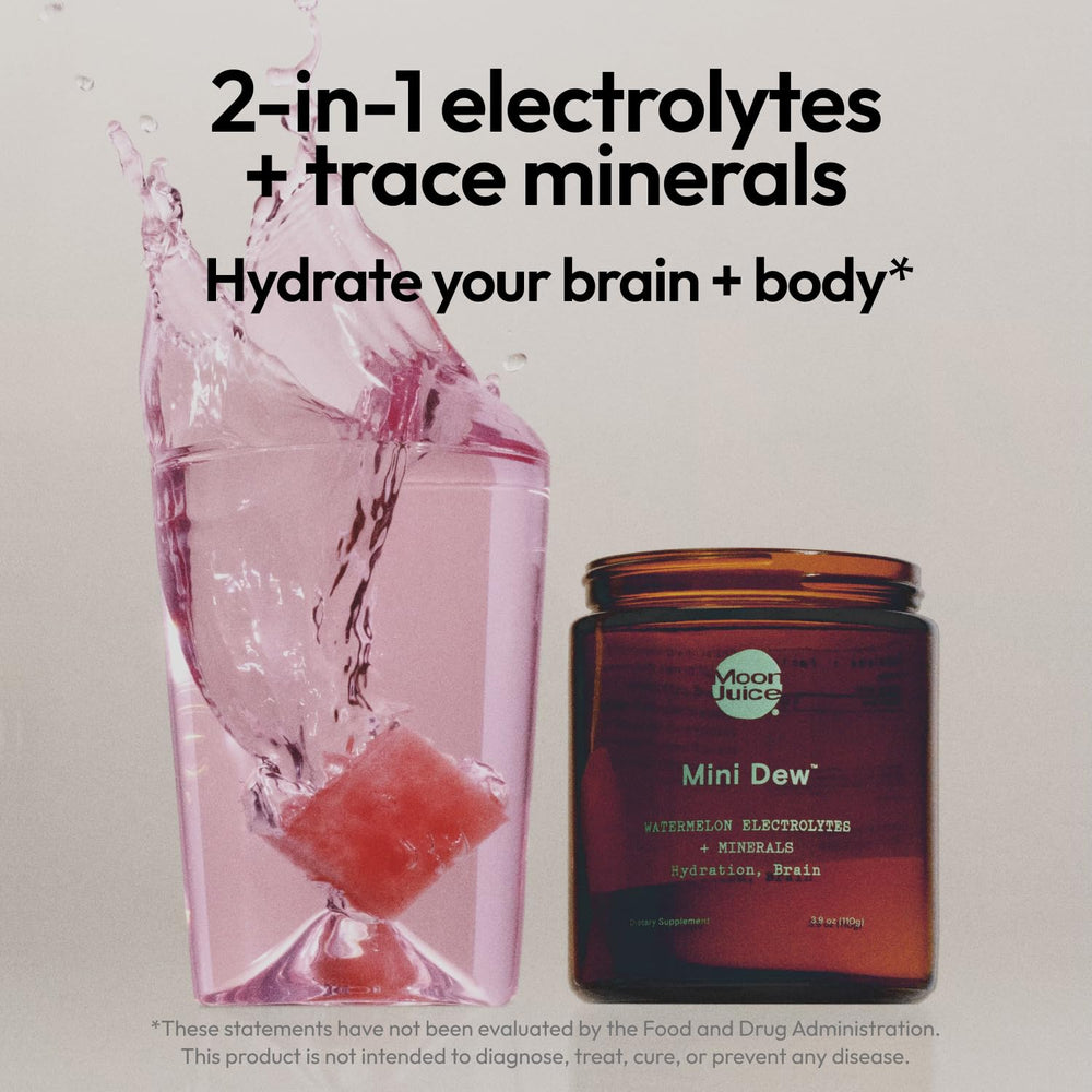 Moon Juice Mini Dew dissolving in water for refreshing brain-friendly hydration
