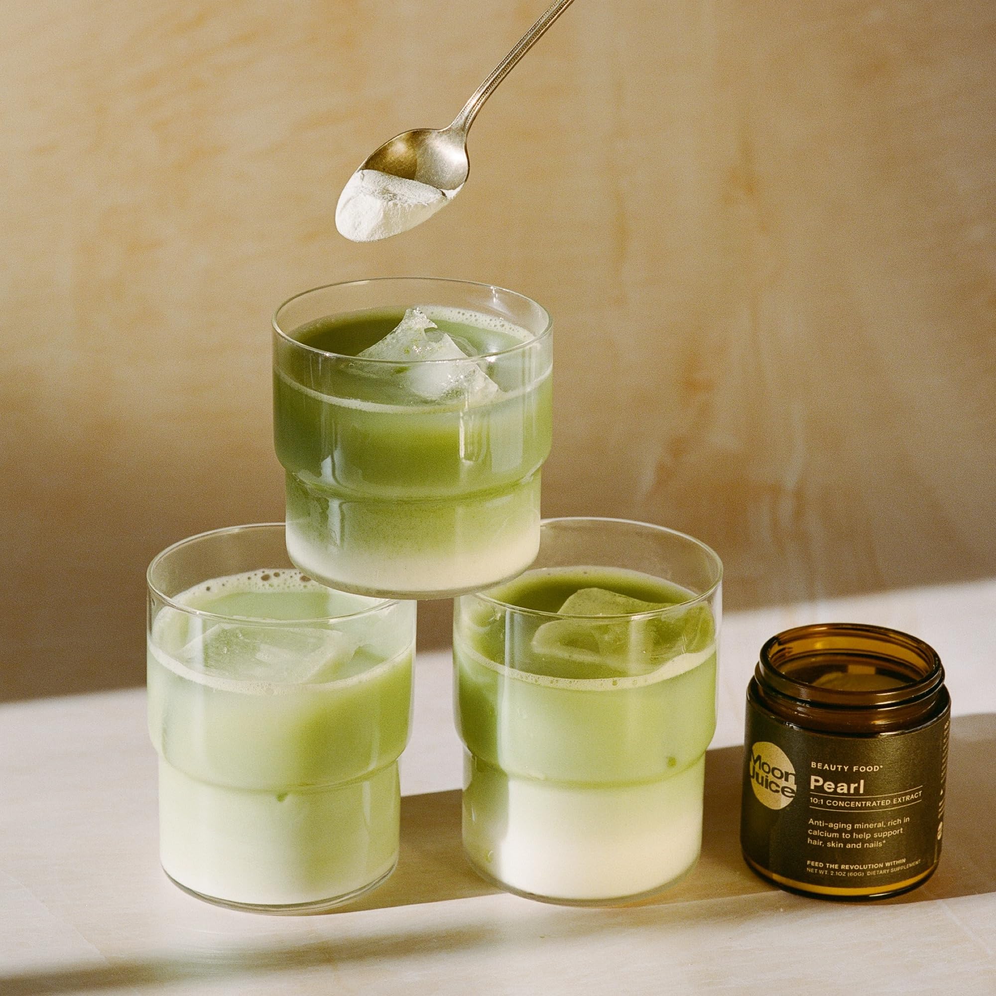Moon Juice Pearl Powder tub highlighting sustainable sourcing and a clean label