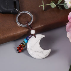 Moonsix crescent moon keychain detachable buckle for easy necklace conversion.