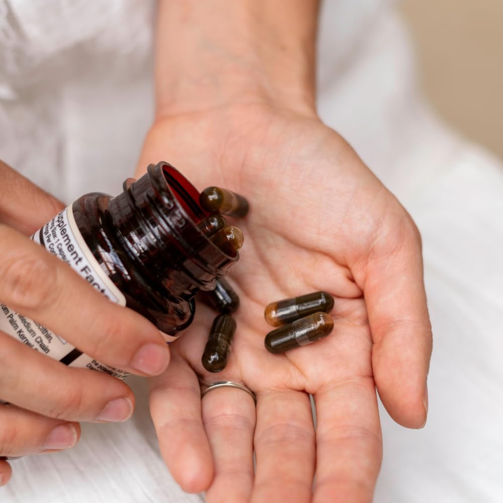 Pouring Goat’s Rue liquid capsules for simple intake