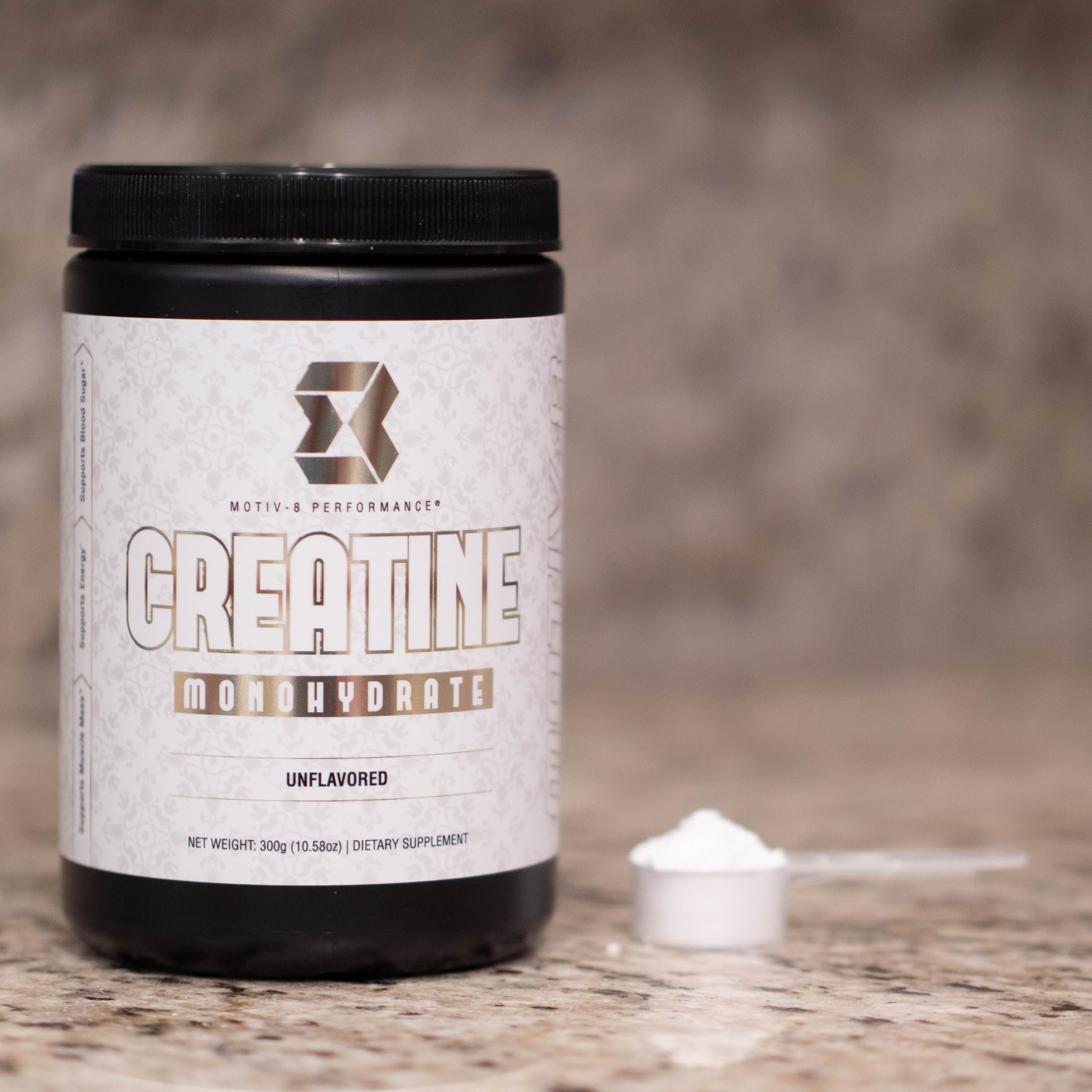 Athlete using Motiv-8 creatine during heavy lifting and training.