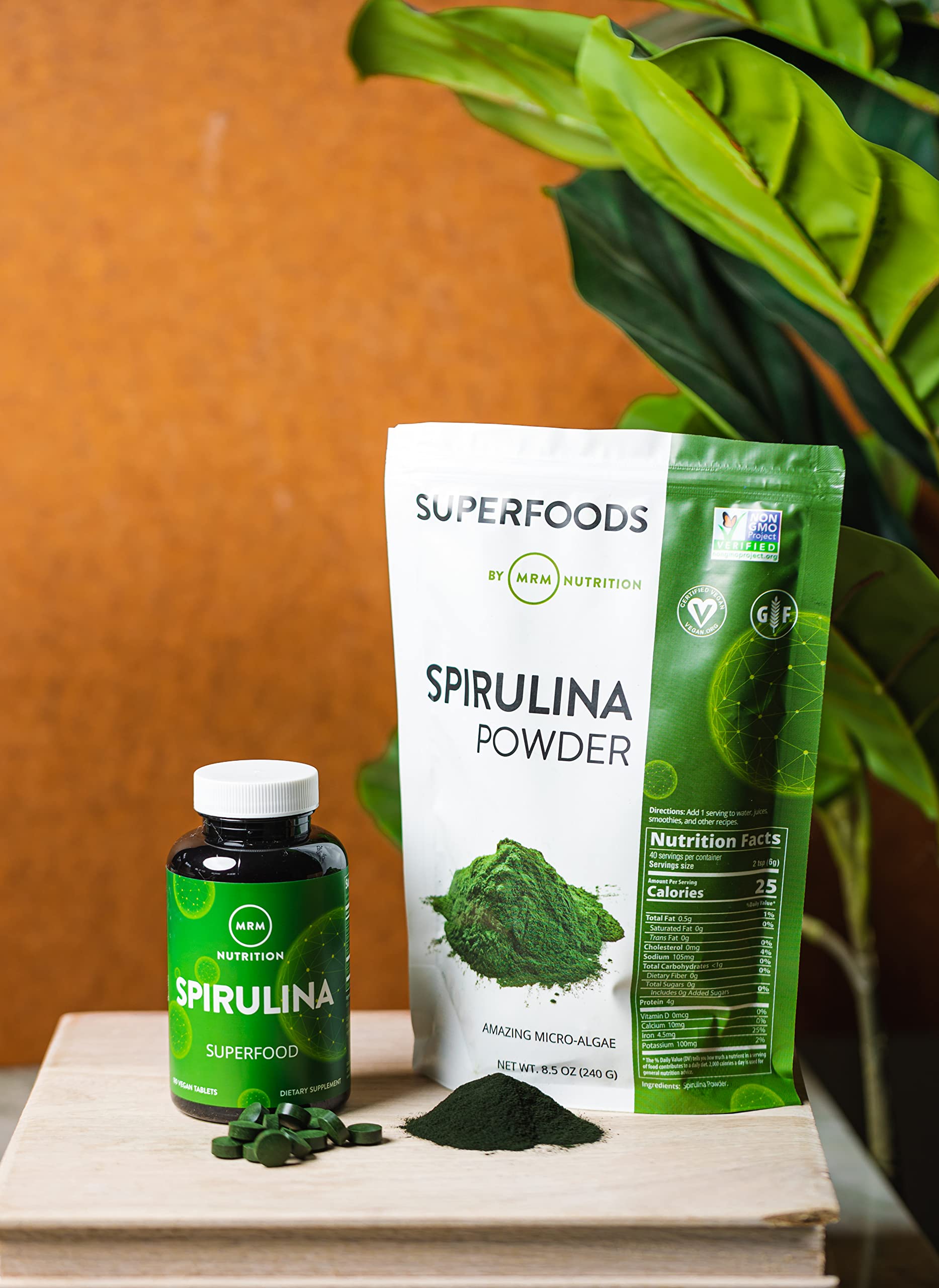 MRM Spirulina powder close-up showing powder pouring for easy shakes.