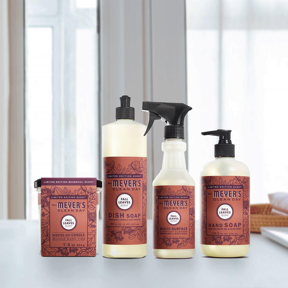 Cruelty-free, scented candle by Mrs. Meyer's in a fall ambiance scene.
