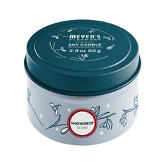 Mrs. Meyer's Snowdrop soy tin candle packaging on display for gifting.