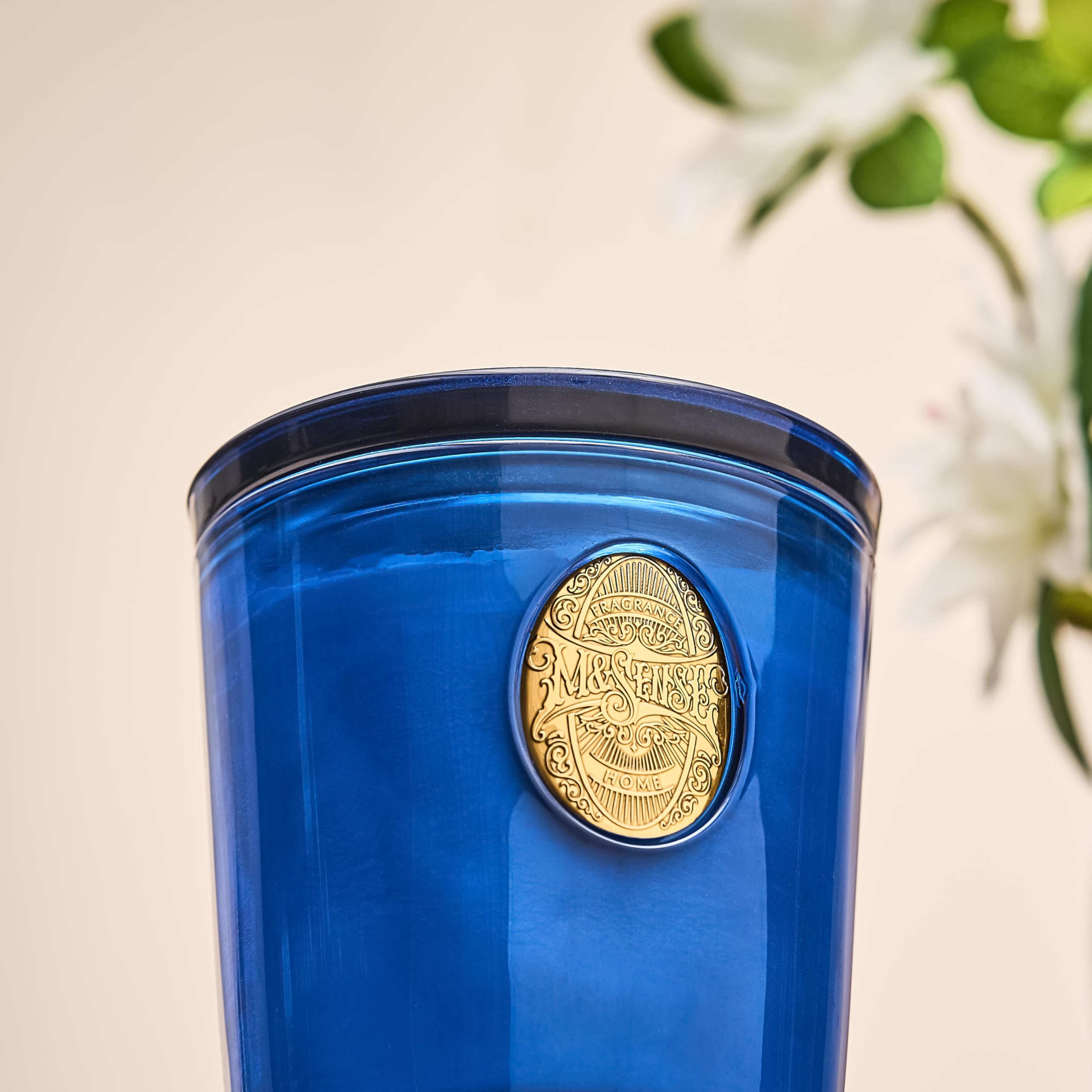 Msense Summer Night Blue candle on office desk for focused atmosphere.