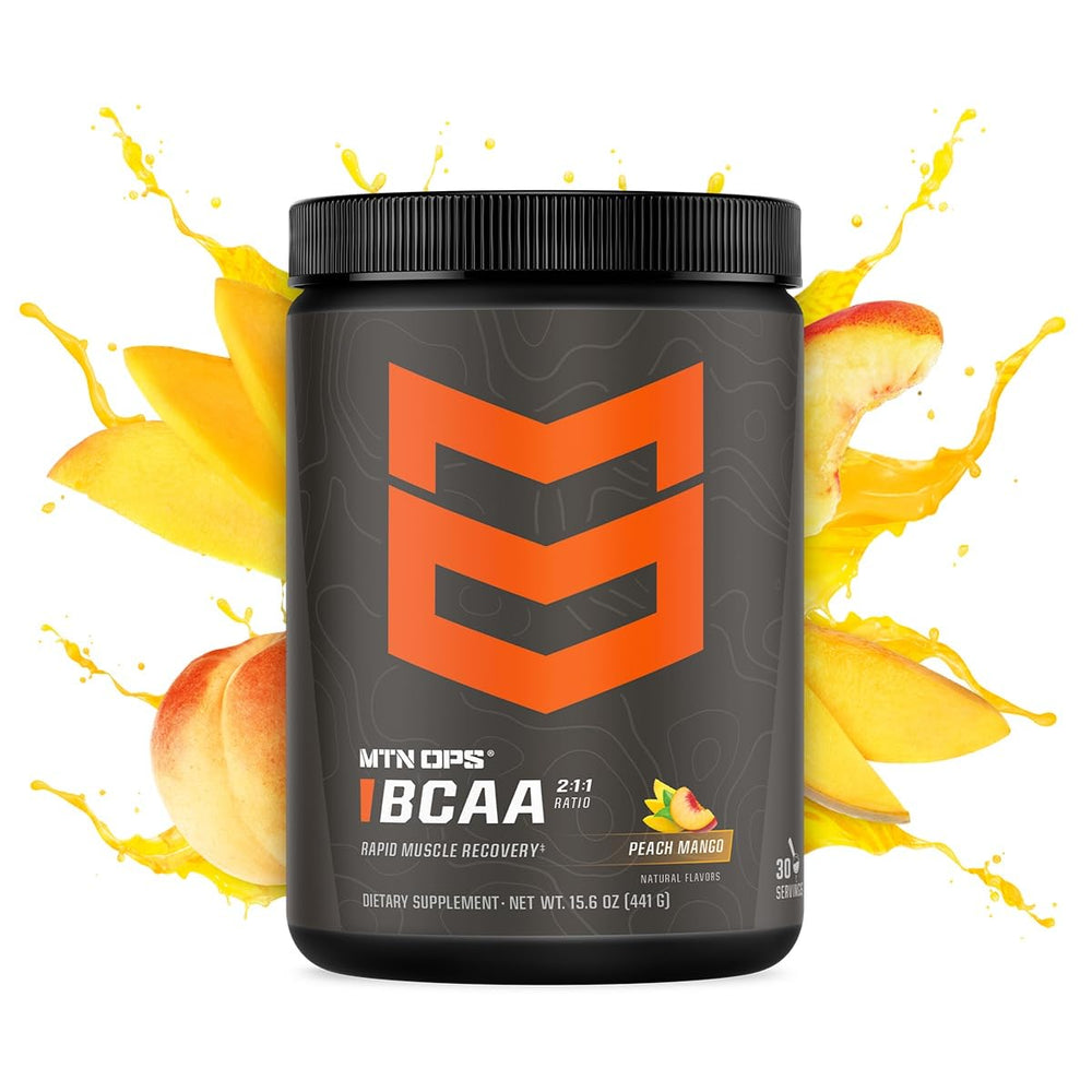 MTN OPS BCAA mixing glass showing peach mango flavor during workout hydration.