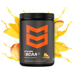 MTN OPS BCAA mixing glass showing peach mango flavor during workout hydration.