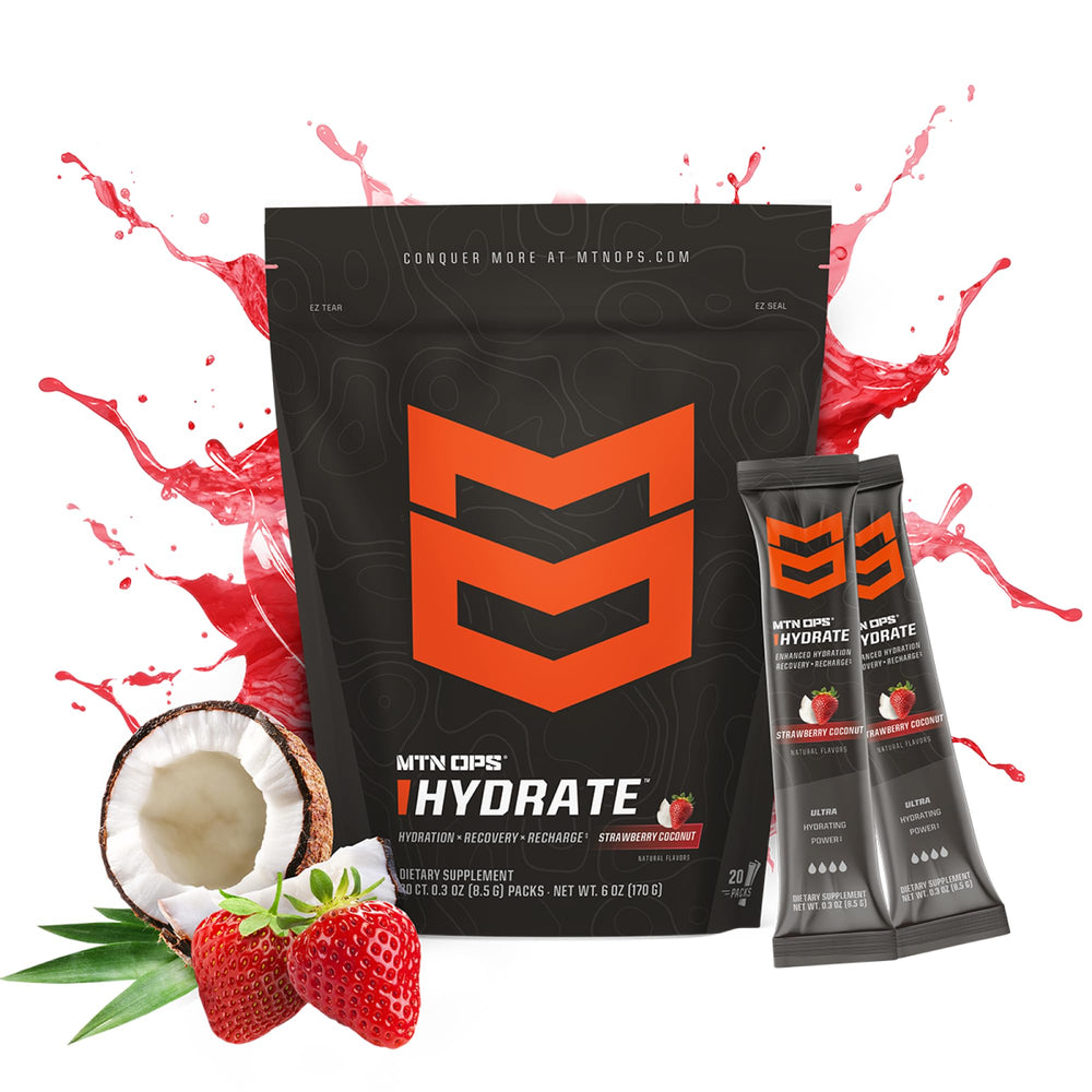 Glass with MTN OPS Hydrate strawberry coconut powder dissolving quickly