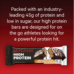 Musashi high protein bar on gym mat suggests convenient snack between workouts.
