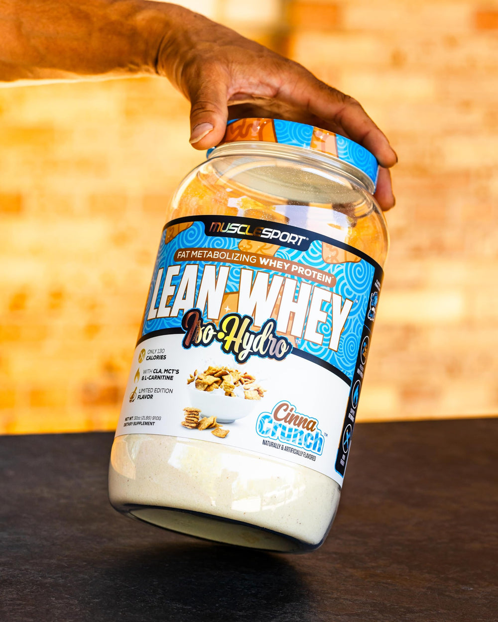 Musclesport Lean Whey Revolution Cinna Crunch image highlights real cereal pieces in flavor.