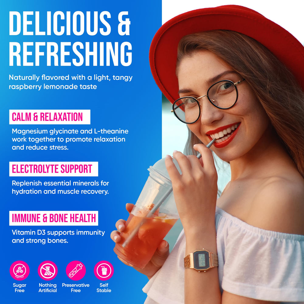 Prepared Vitamuse drink in hand, showcasing bright raspberry lemonade flavor and refreshment.