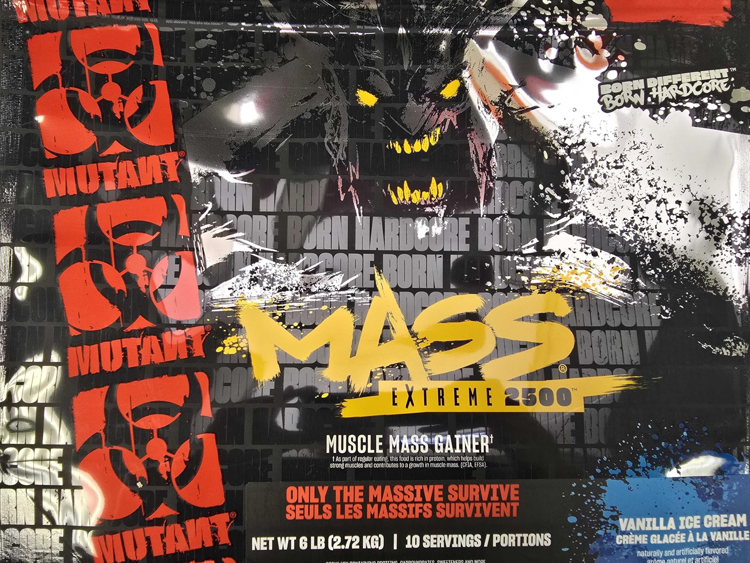 Mutant Mass Extreme Gainer shake in a glass with measuring scoop for prep.