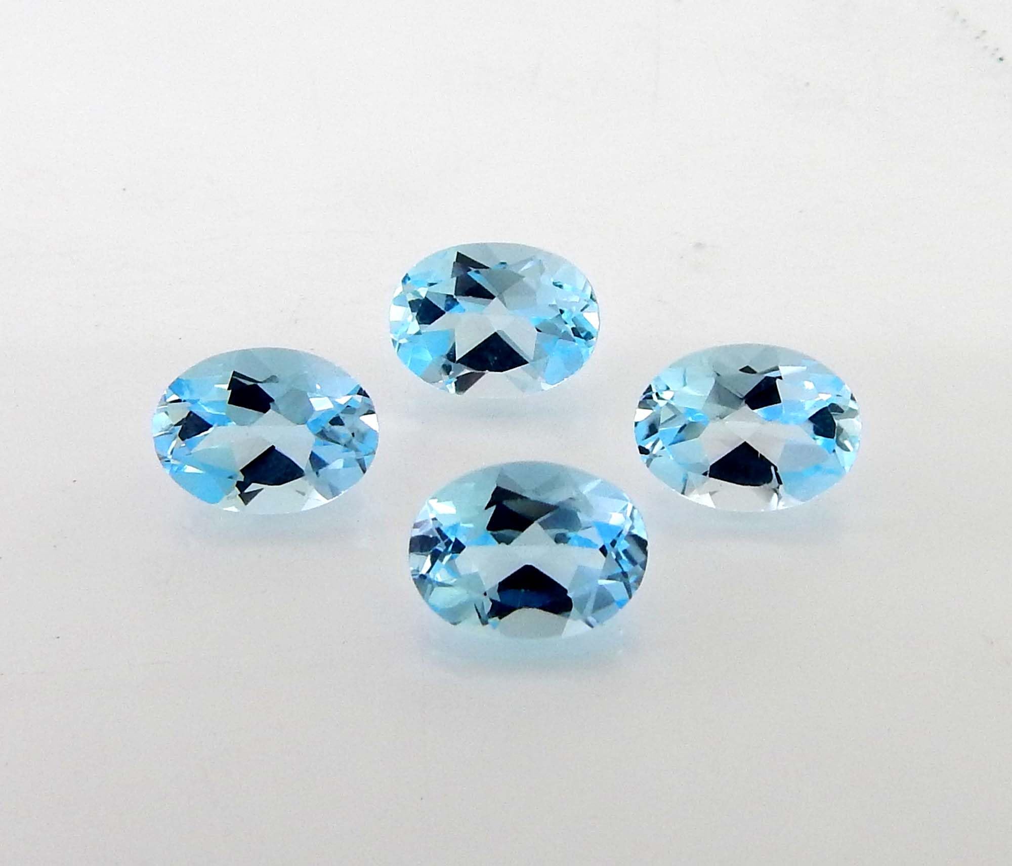 Myhealingworld blue topaz oval 4x6mm four-stone close-up highlights facets and blue brilliance