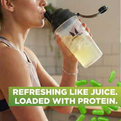 Cold translucent Clear Whey drink in glass after a workout