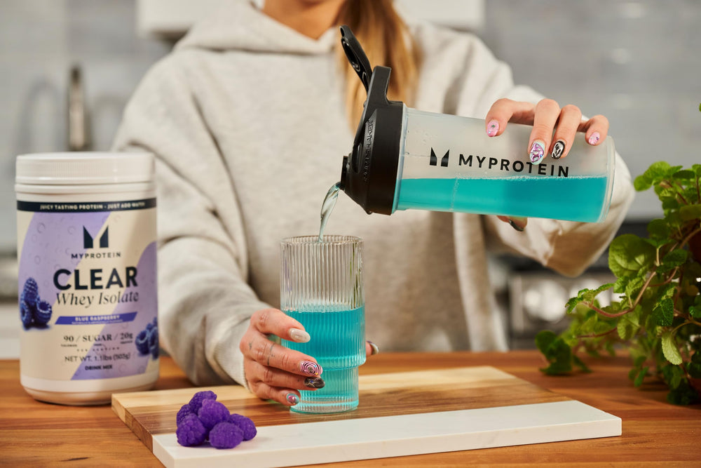 Myprotein Clear Whey Isolate glass with water highlights lean hydration.