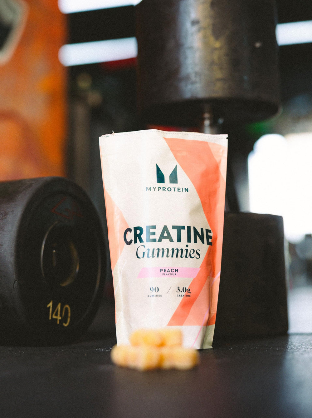 Myprotein Creatine Gummies raspberry flavor close-up emphasizes tasty pre-workout appeal for focus.