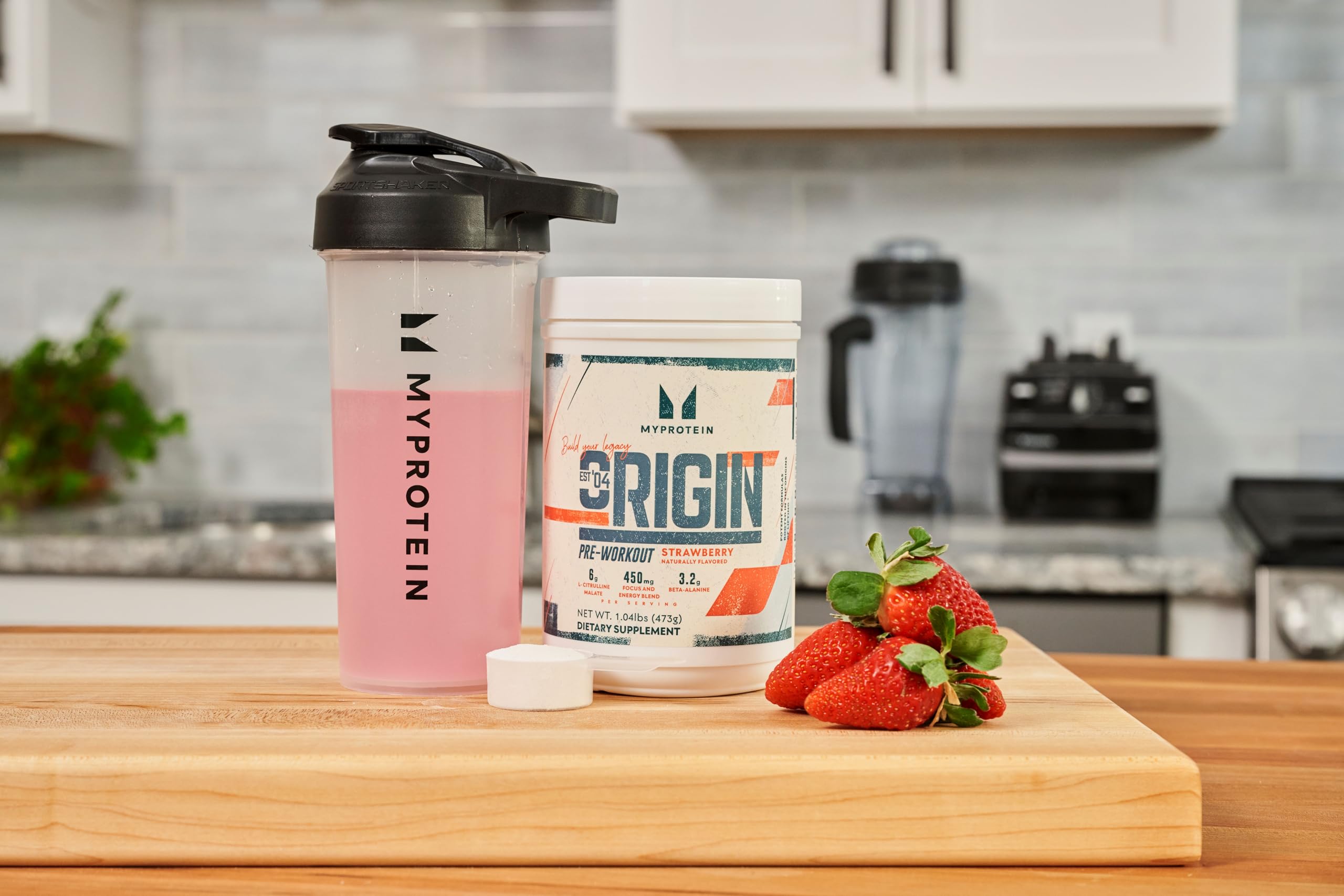Shaker with Origin Pre-Workout ready for a strawberry-flavored workout session.
