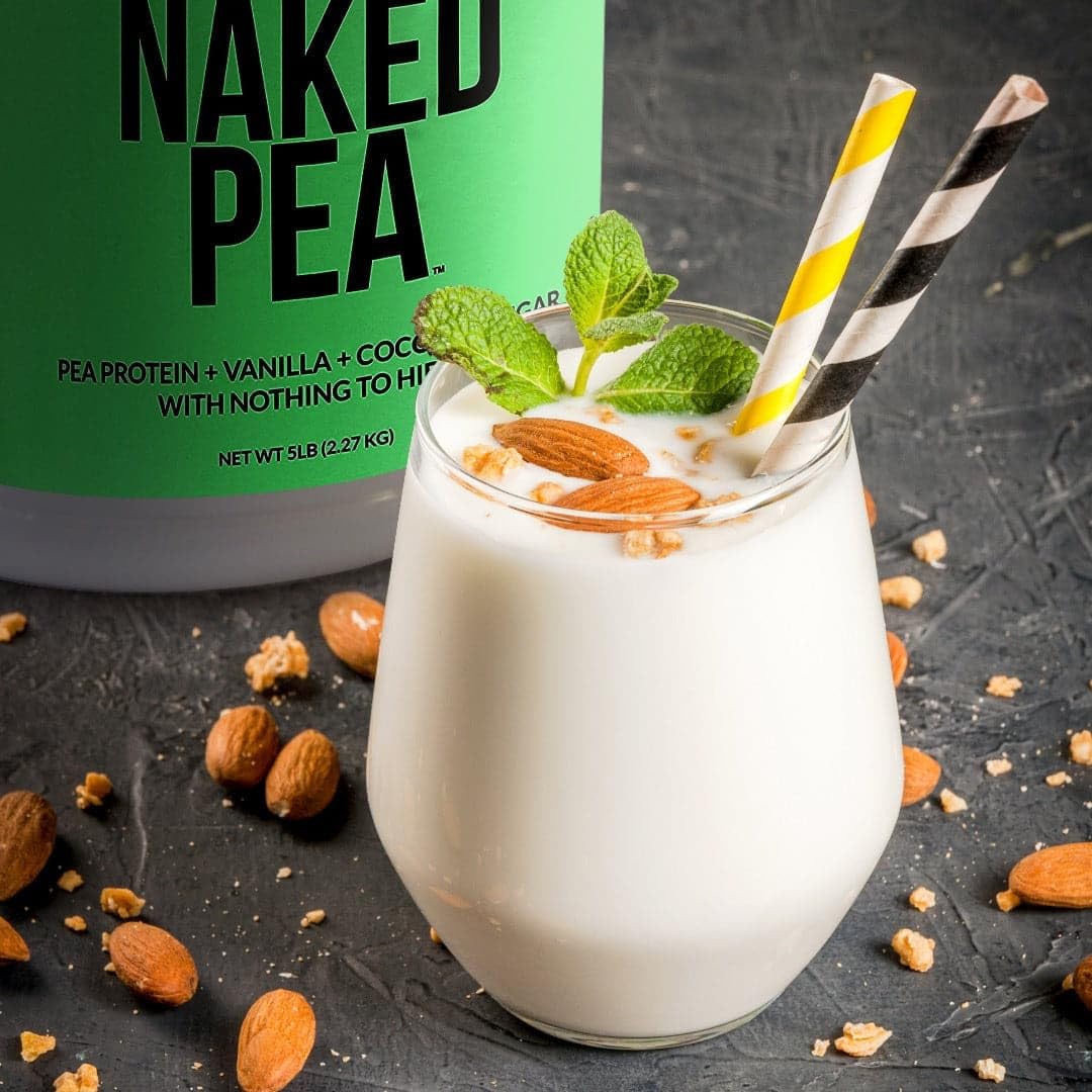 NAKED Vanilla Pea Protein scoop on the counter for easy measuring.