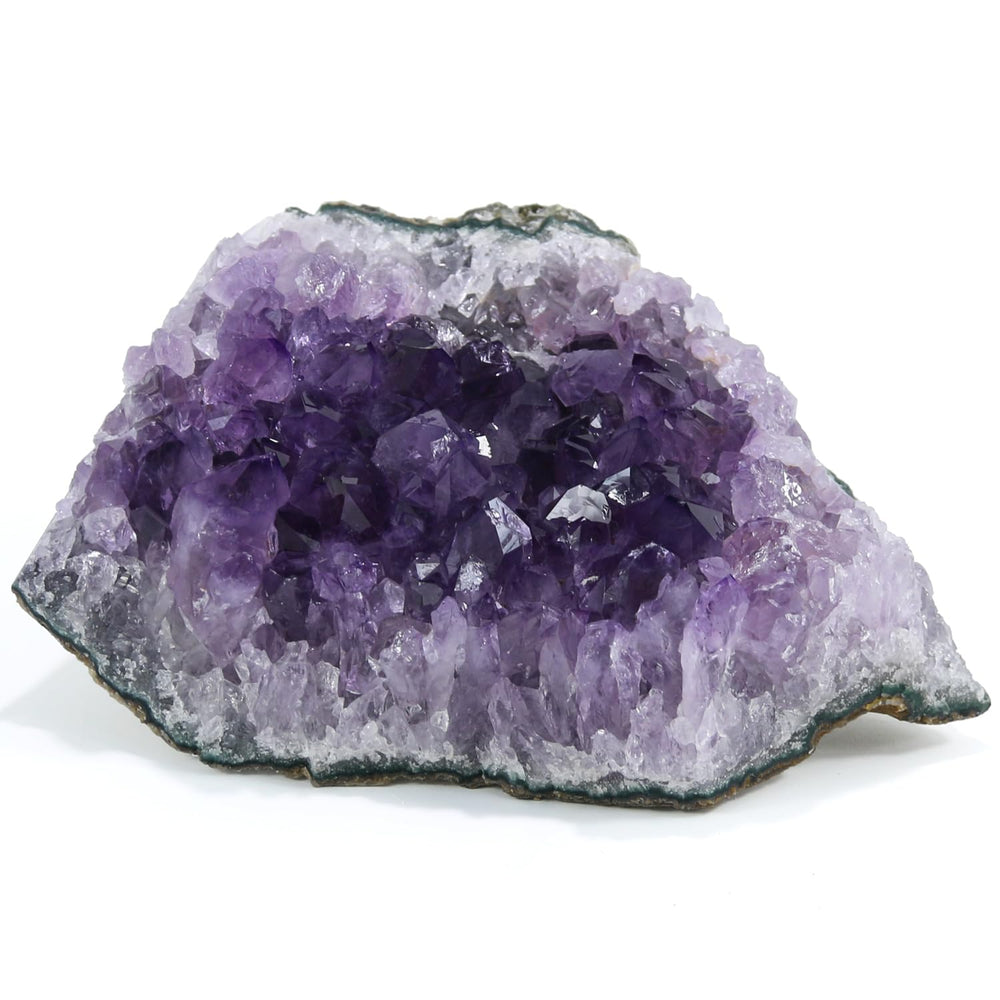 Namzi amethyst crystal geode close-up, enhances meditation ambiance and focus.
