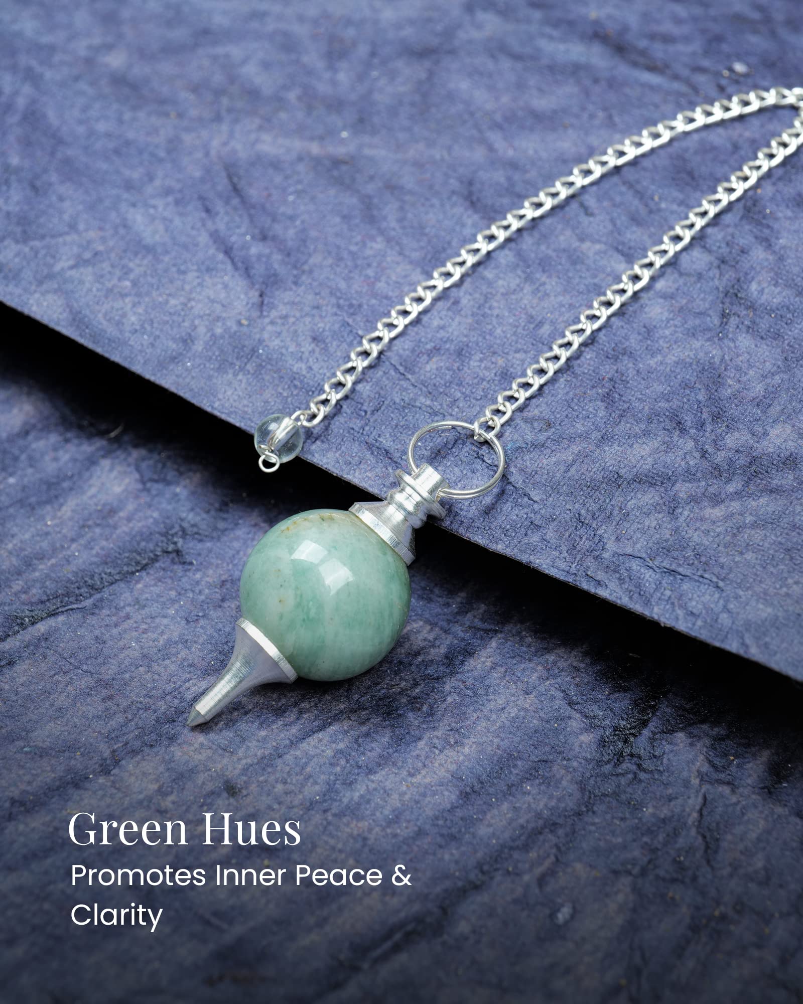Naribabu heart chakra focus with aventurine pendulum during meditation.